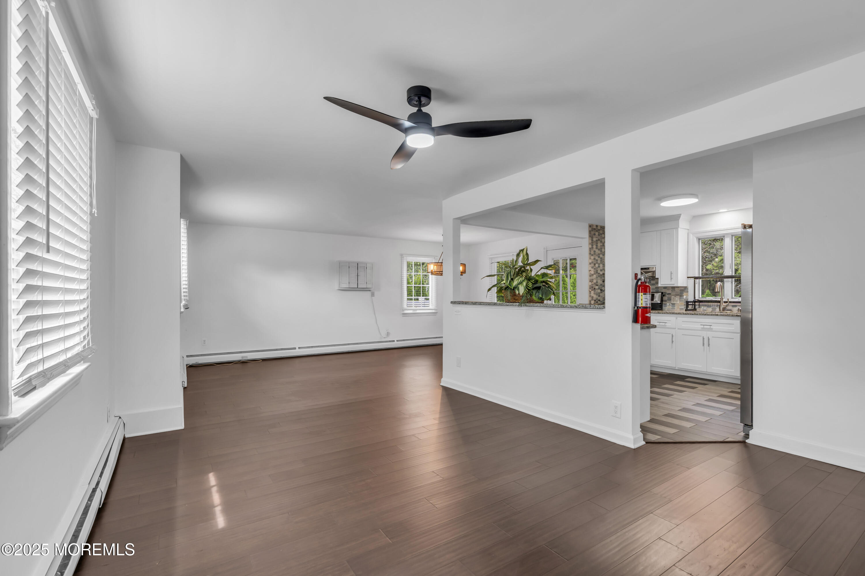 2 Schiverea Avenue Freehold, NJ 07728 - Photo 5 of 36 a view of a livingroom with wooden floor and a ceiling fan