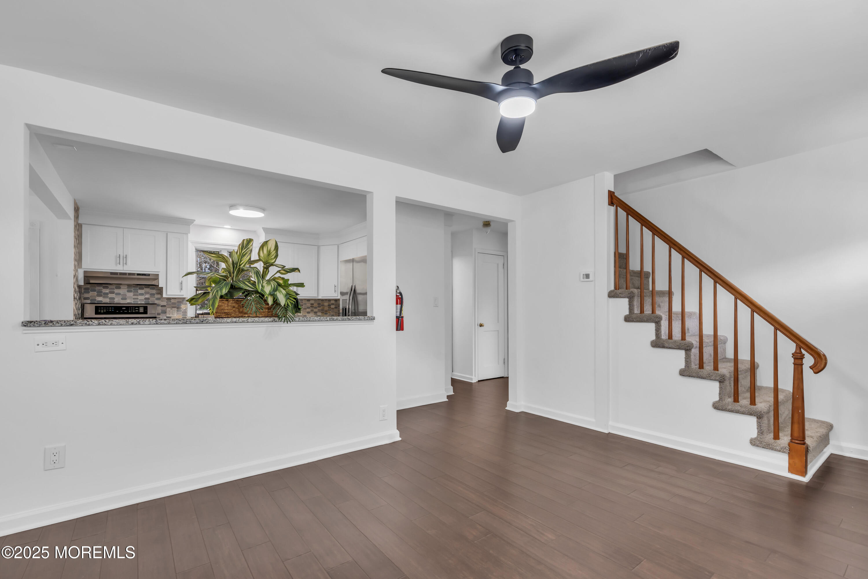 2 Schiverea Avenue Freehold, NJ 07728 - Photo 6 of 36 a hallway with wooden floor and ceiling fan