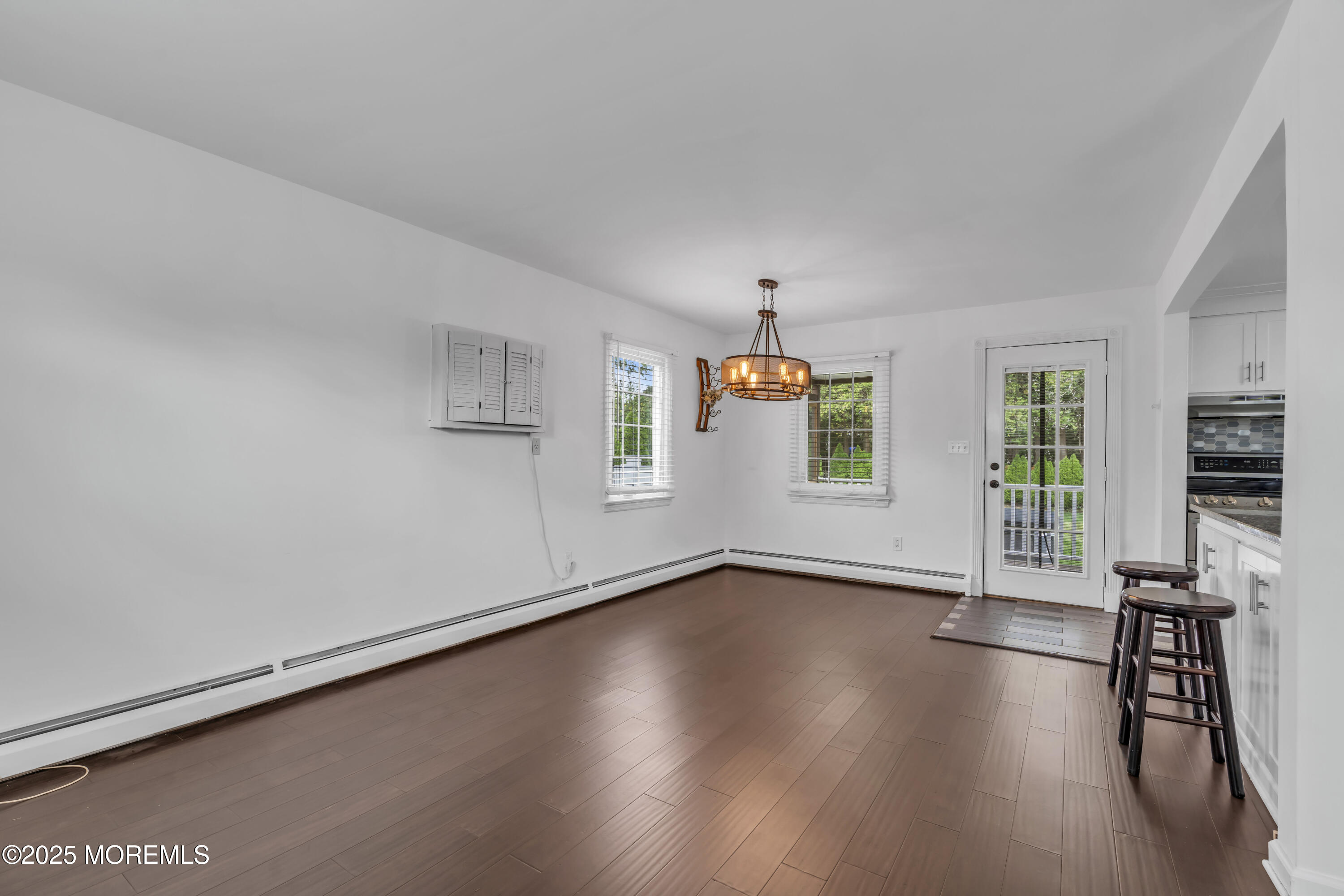 2 Schiverea Avenue Freehold, NJ 07728 - Photo 7 of 36 a view of a livingroom with wooden floor and a window