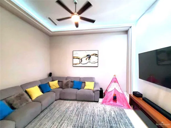 a bedroom with a bed couch and a window