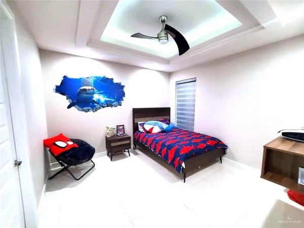 a bedroom with a bed and a fireplace