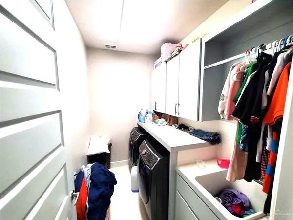 a utility room with dryer and washer