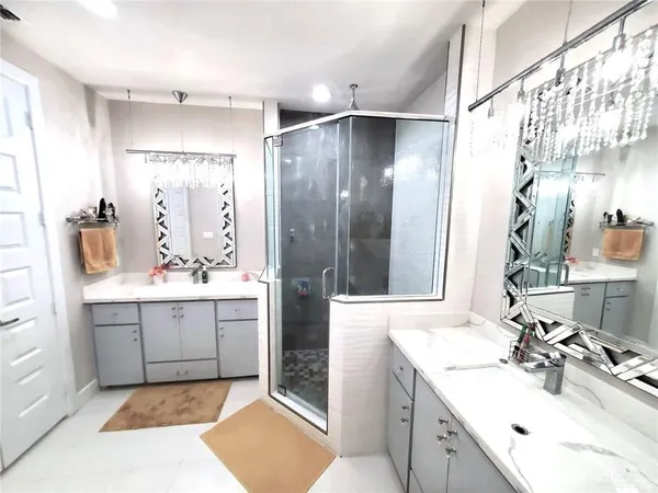 a bathroom with a sink double vanity and a mirror