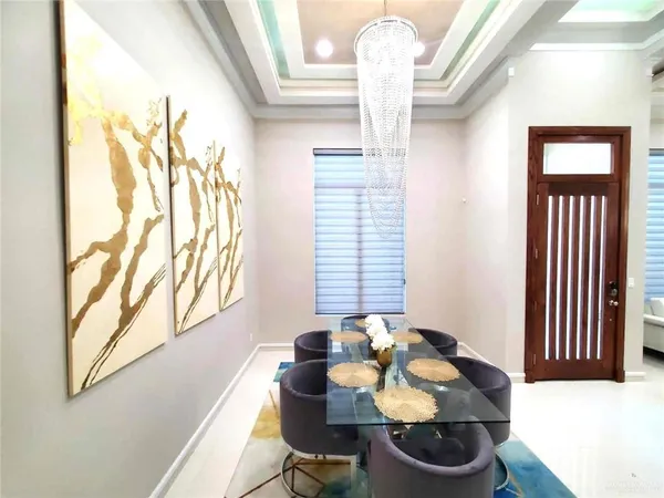 a dining room with furniture and window