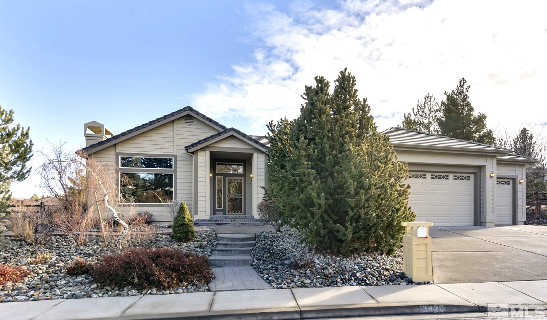 3420 Cheechako Drive Reno, NV 89519 - Photo 1 of 30 a front view of house with trees and trees in the background