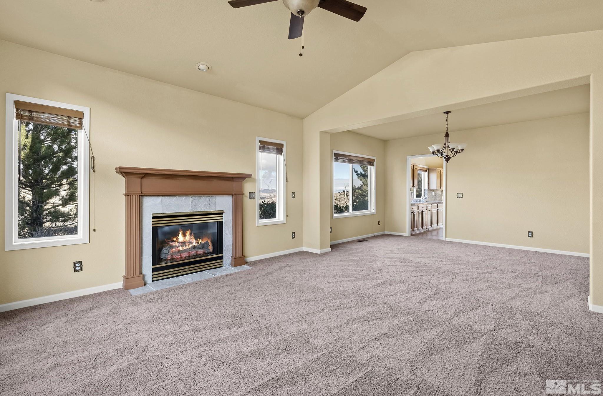 3420 Cheechako Drive Reno, NV 89519 - Photo 11 of 30 a view of an empty room with a fireplace