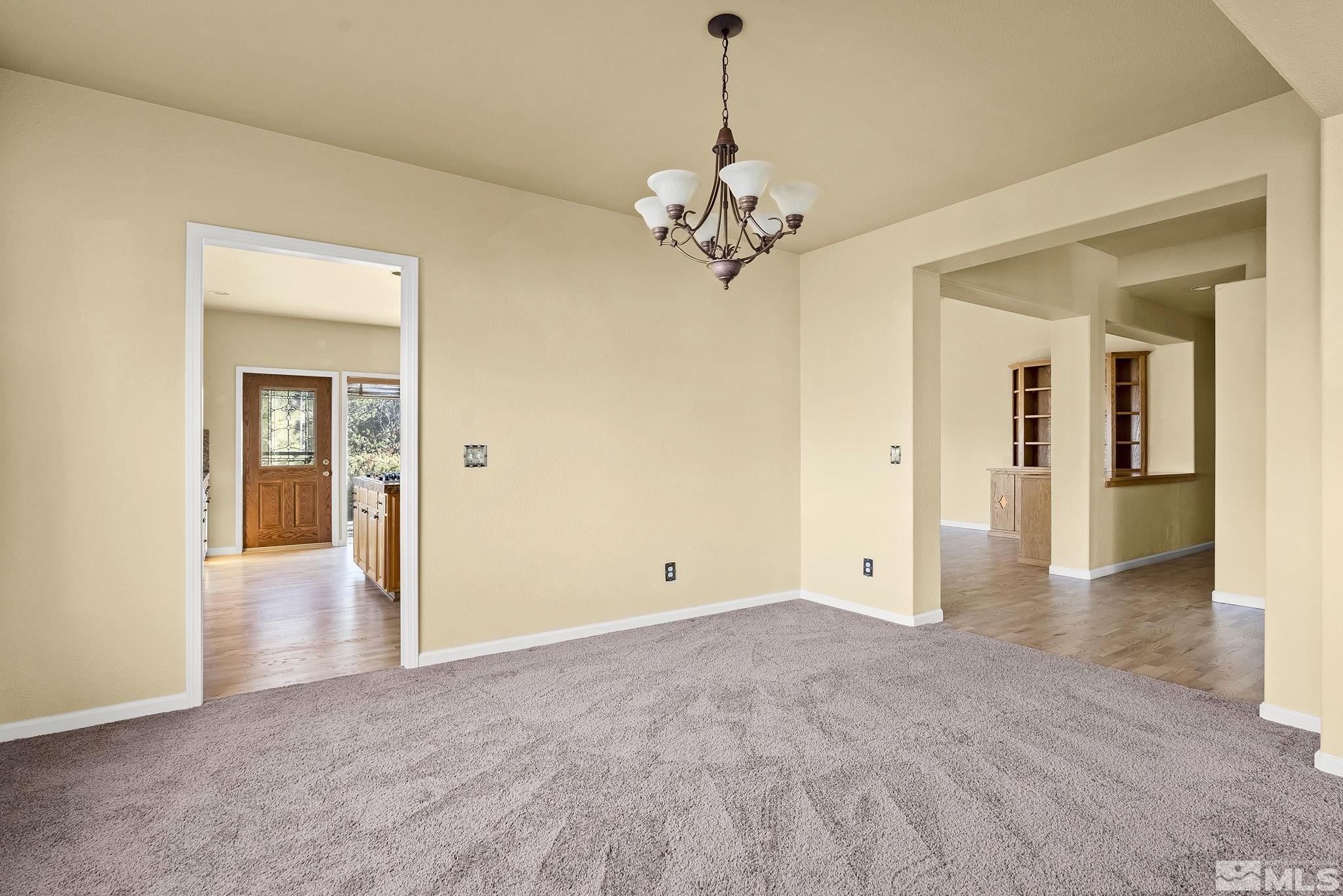 3420 Cheechako Drive Reno, NV 89519 - Photo 13 of 30 a view of a livingroom with a chandelier fan and windows