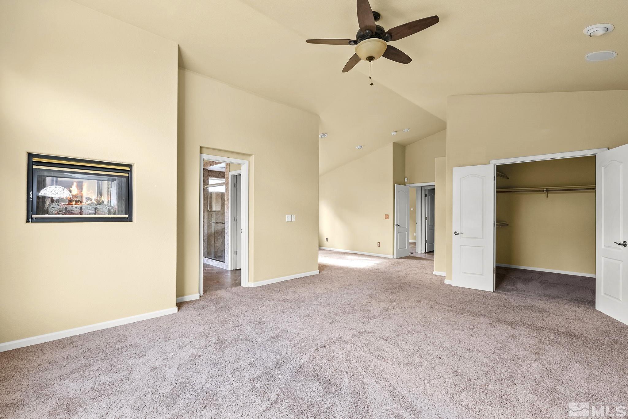 3420 Cheechako Drive Reno, NV 89519 - Photo 17 of 30 an empty room with windows and a ceiling fan