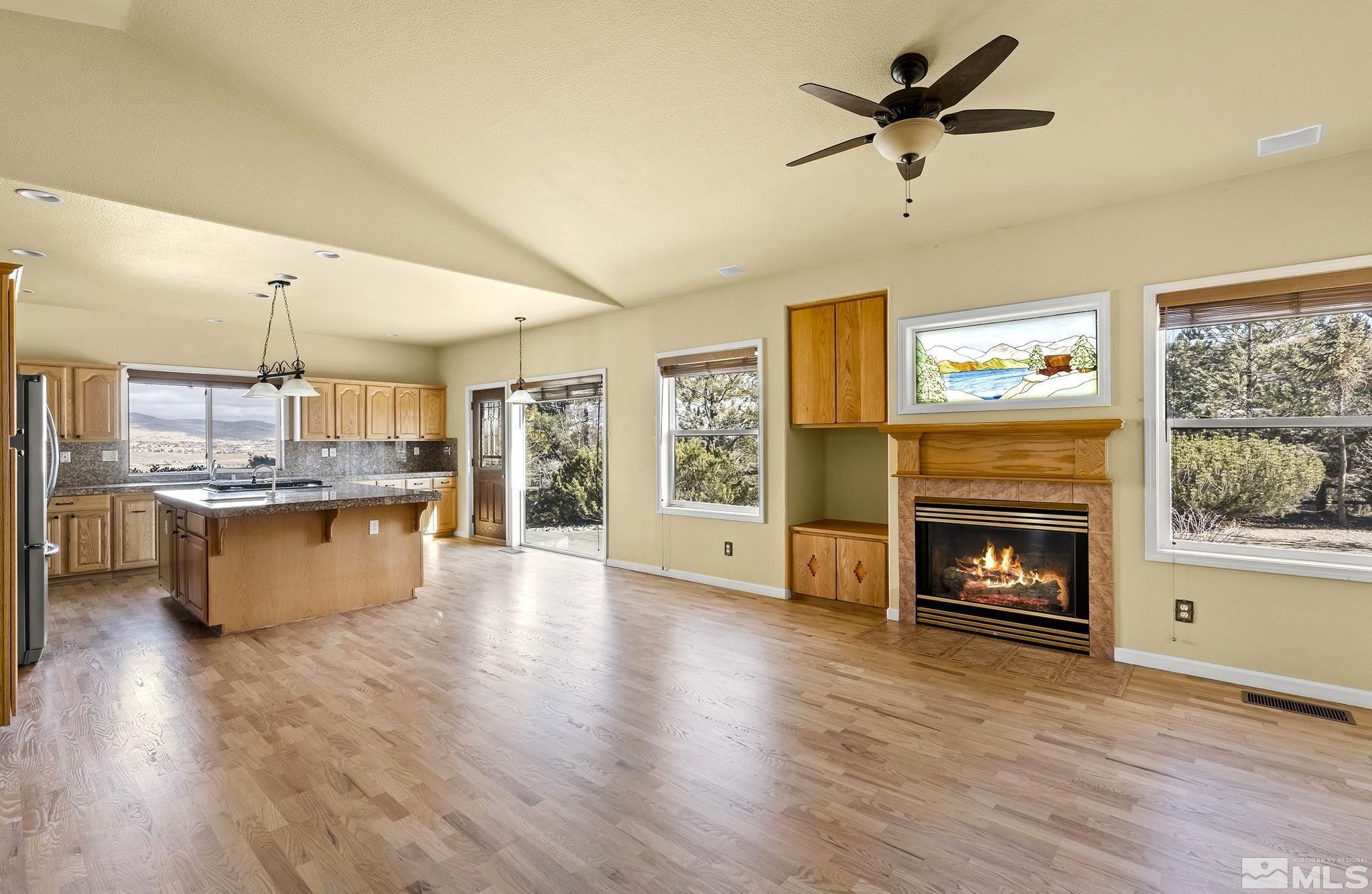3420 Cheechako Drive Reno, NV 89519 - Photo 2 of 30 a view of kitchen with microwave a stove and wooden floor
