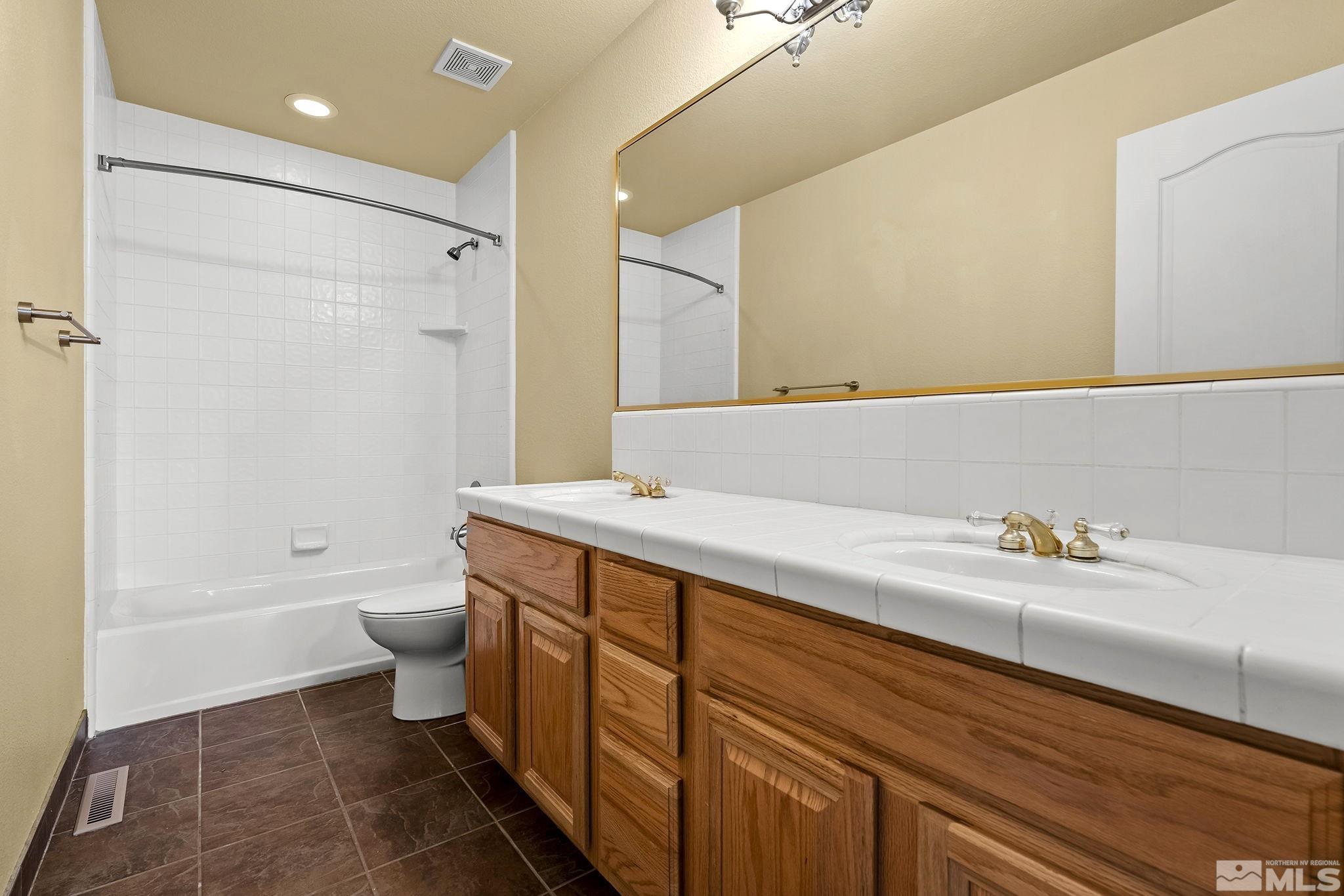 3420 Cheechako Drive Reno, NV 89519 - Photo 21 of 30 a bathroom with a sink a toilet and shower