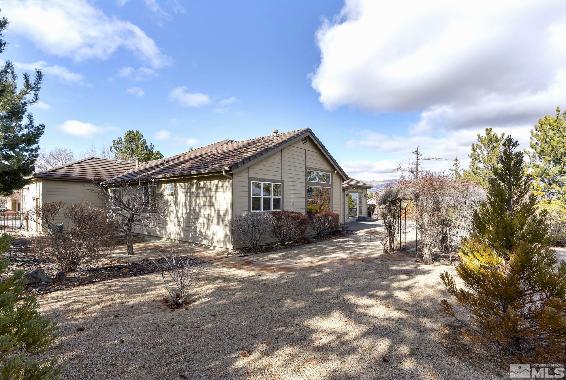 3420 Cheechako Drive Reno, NV 89519 - Photo 25 of 30 a view of a house with wooden fence