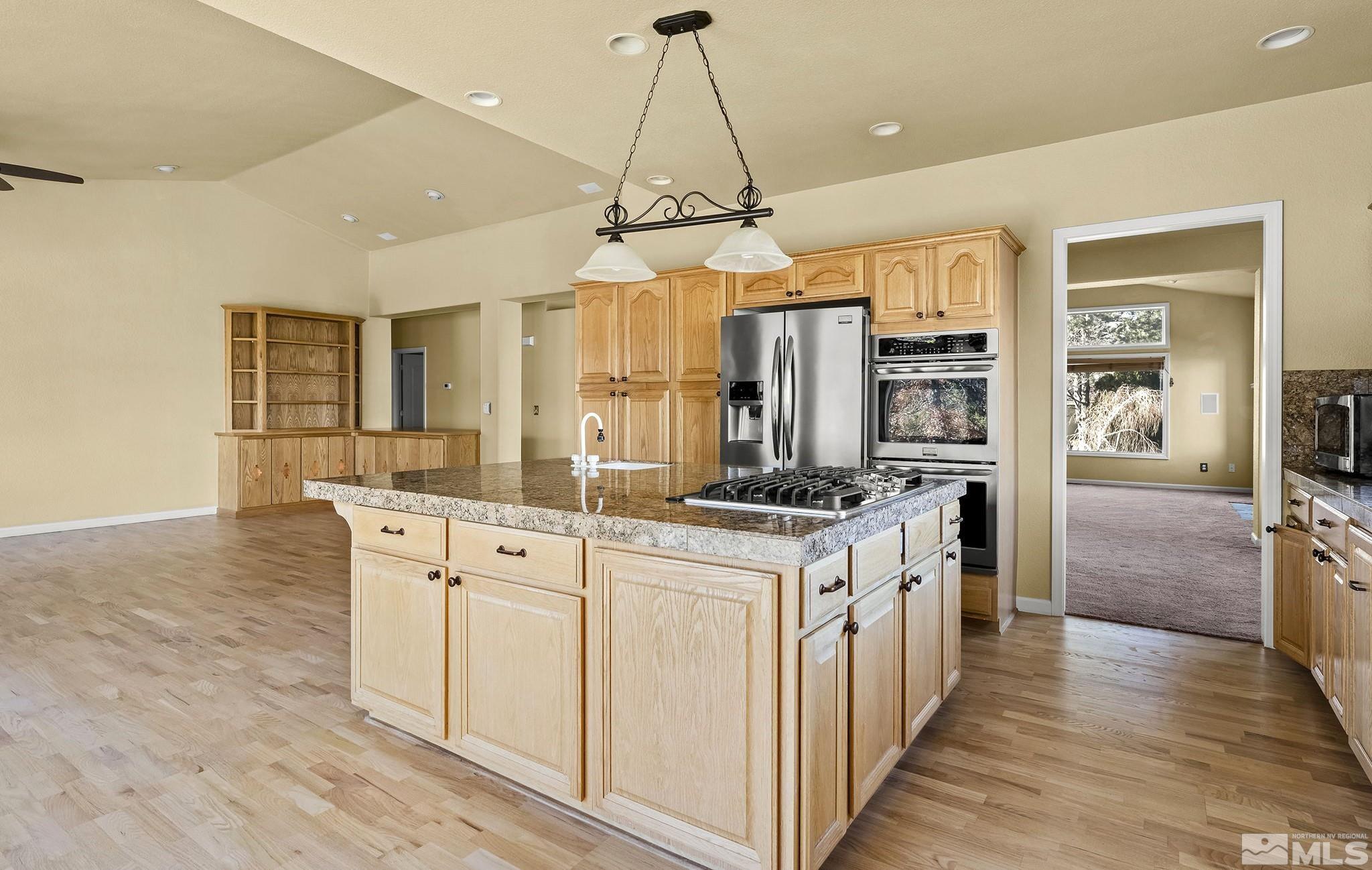 3420 Cheechako Drive Reno, NV 89519 - Photo 6 of 30 a kitchen with stainless steel appliances a stove sink and refrigerator