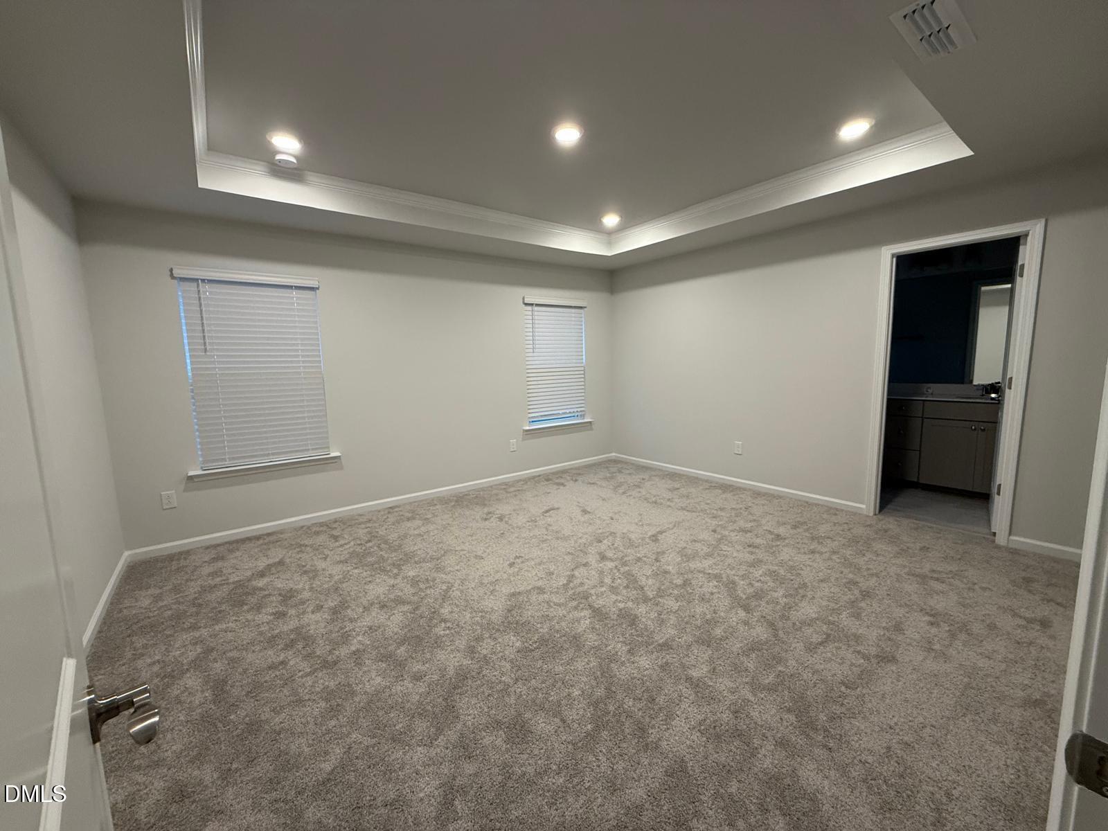 7224 Morris Acres Road Apex, NC 27523 - Photo 12 of 23 an empty room with a empty space and windows