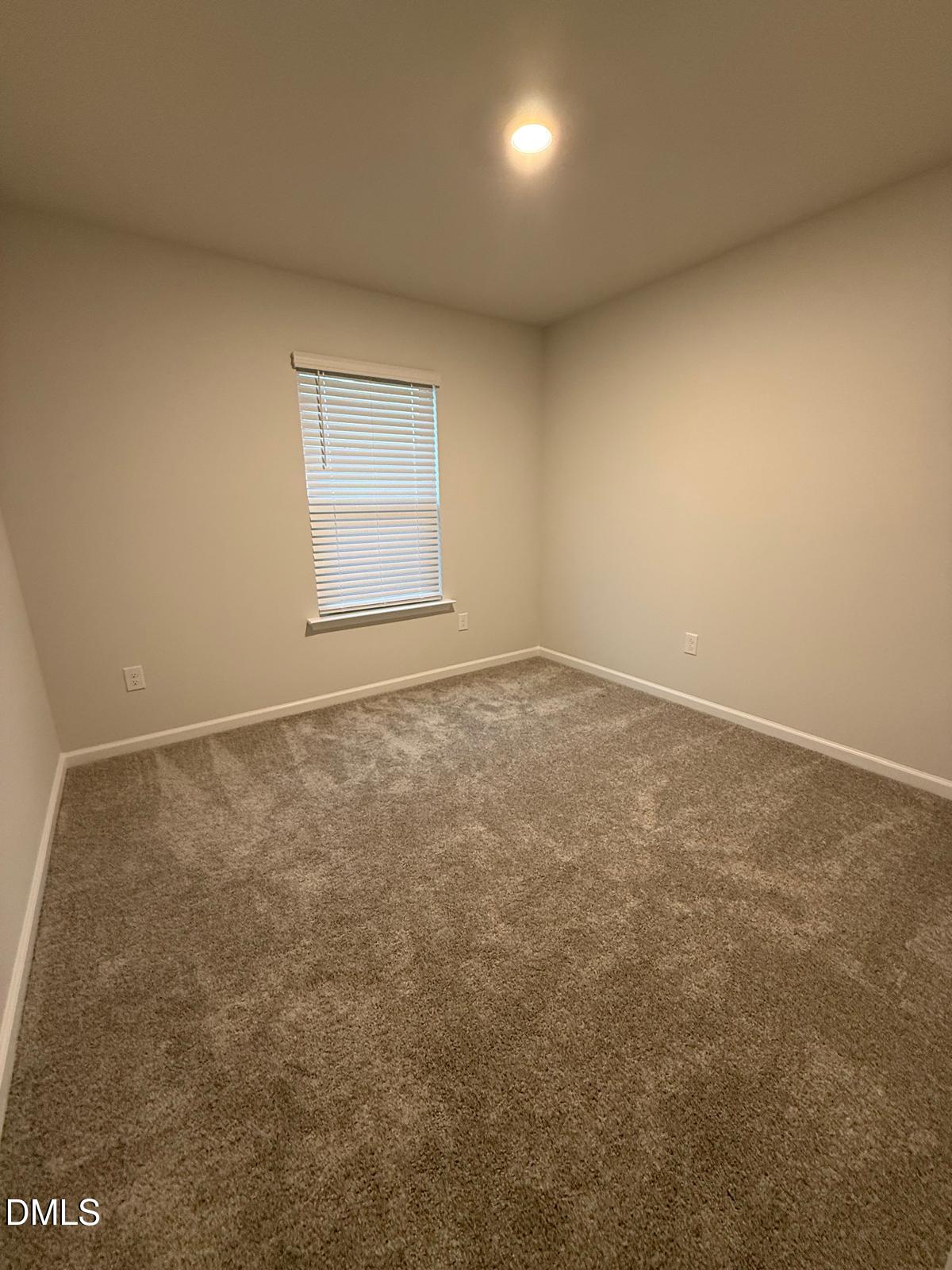 7224 Morris Acres Road Apex, NC 27523 - Photo 16 of 23 an empty room with a natural light