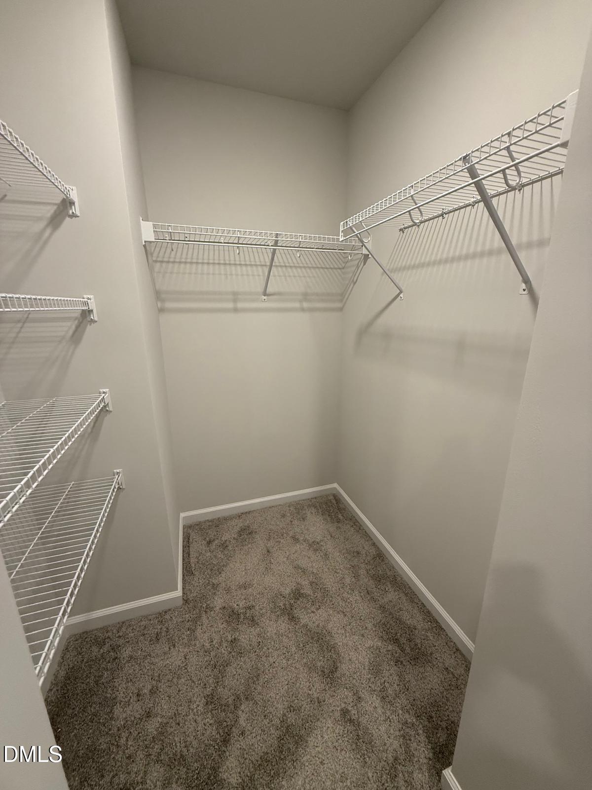 7224 Morris Acres Road Apex, NC 27523 - Photo 19 of 23 a view of a room with racks on the wall