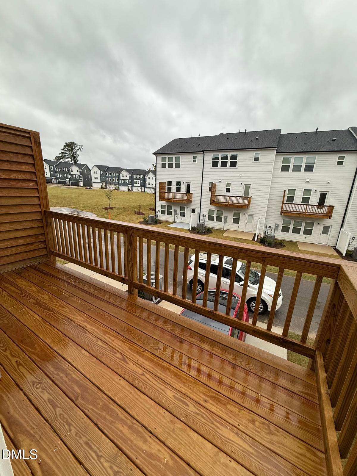7224 Morris Acres Road Apex, NC 27523 - Photo 22 of 23 a view of a balcony with wooden floor