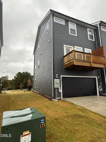 a kitchen with kitchen island a counter space a stainless steel appliances cabinets and a chandelier