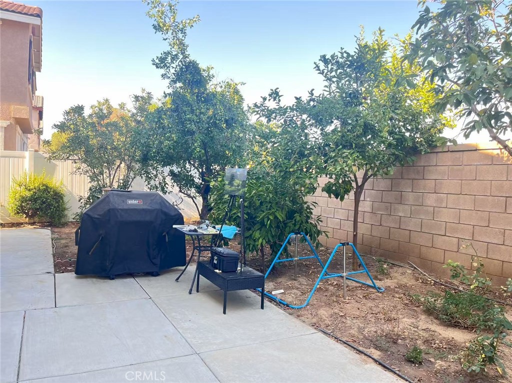 1662 Palermo Drive Riverside, CA 92507 - Photo 17 of 30 a backyard of a house with barbeque oven table and chairs