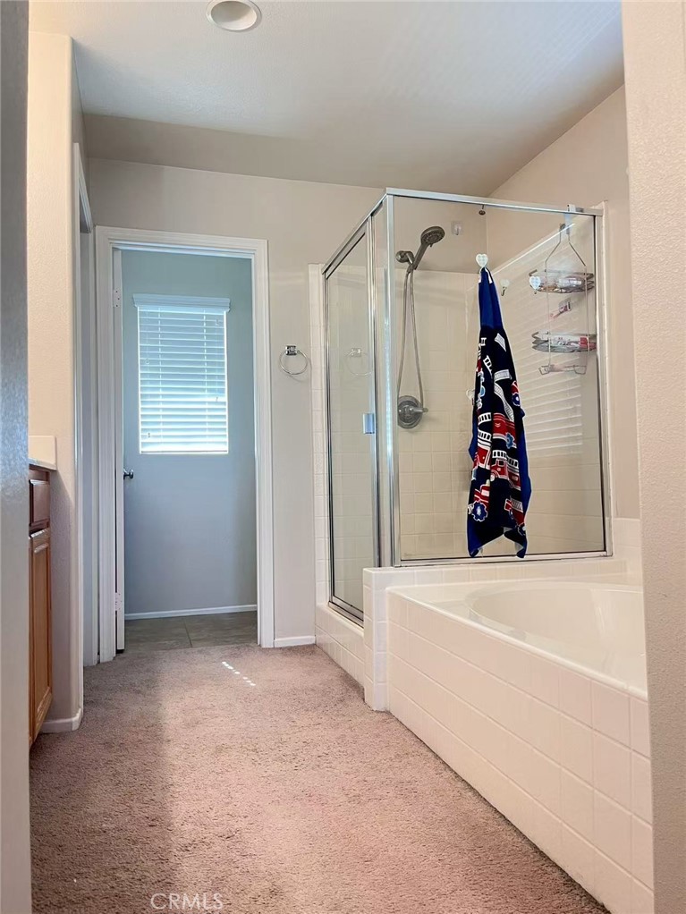 1662 Palermo Drive Riverside, CA 92507 - Photo 9 of 30 a view of walk in closet with clothes and shoes