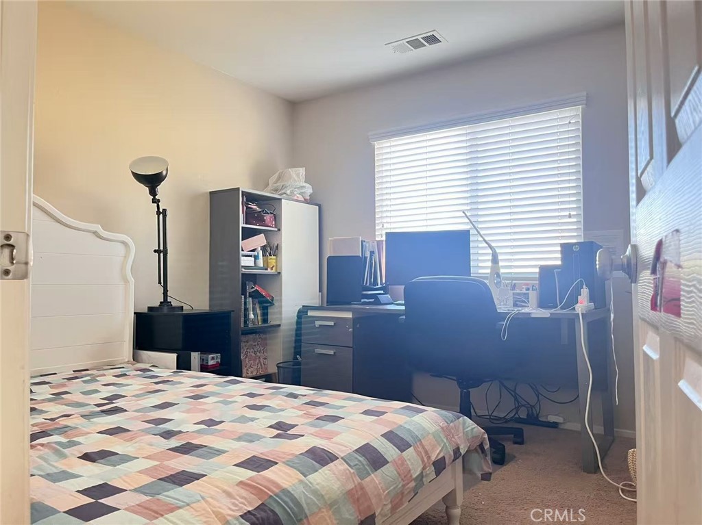 1662 Palermo Drive Riverside, CA 92507 - Photo 10 of 30 a bedroom with a bed and a dresser