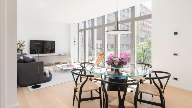 a view of a dining room with furniture window and outside view