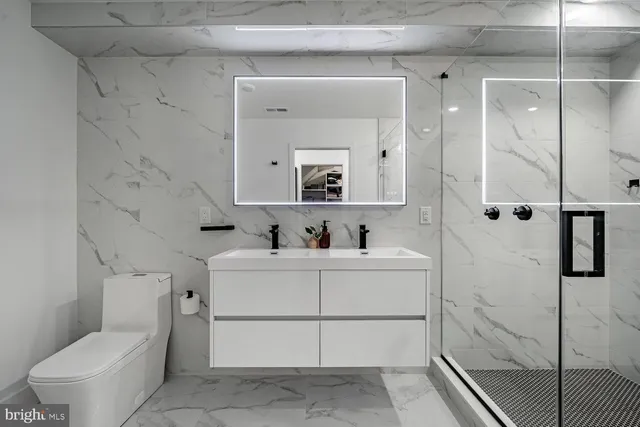 a bathroom with a sink and mirror