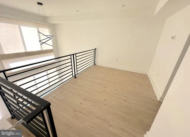 a view of a livingroom with wooden floor
