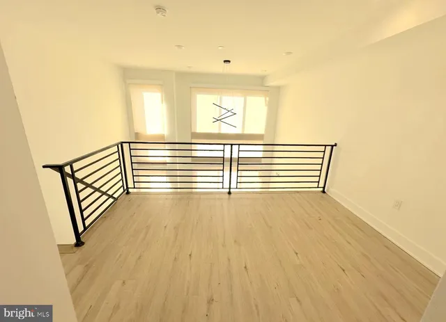 a white toilet sitting next to a sink