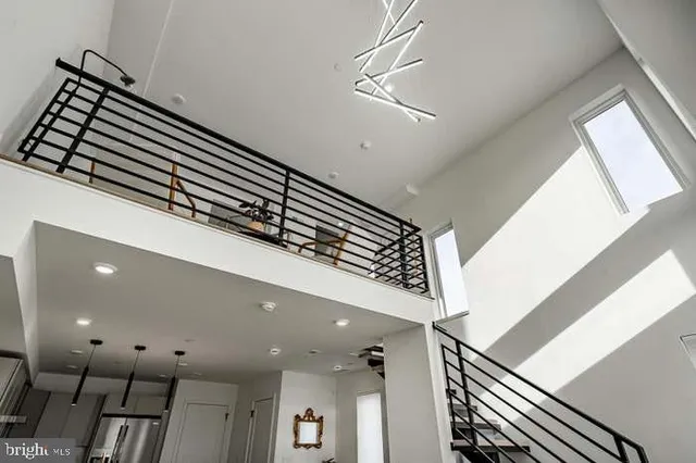 a kitchen with stainless steel appliances granite countertop a stove a refrigerator and a sink