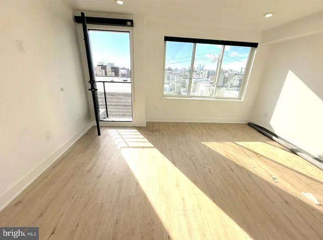 a living room with a couch and a fireplace