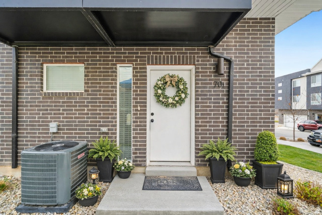 70 East Weekes Way Clearfield, UT 84015 - Photo 21 of 25 Property entrance featuring brick siding and covered porch