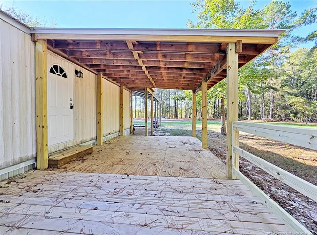 a view of a porch with a wooden floor