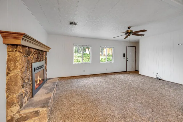 a view of an empty room with a window