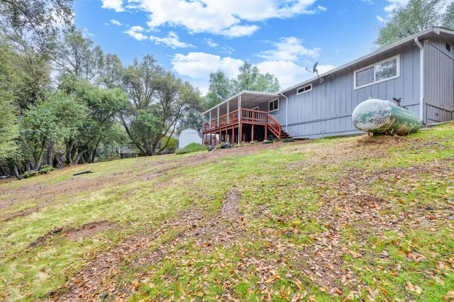 a house view with a backyard space