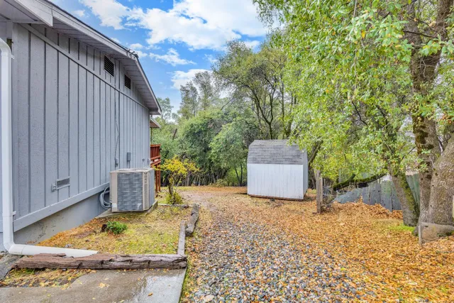 a view of a house with a small yard