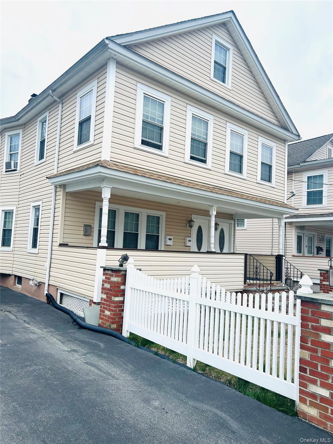 9 Lawrence Road Poughkeepsie, NY 12601 - Photo 5 of 9 a front view of a house with a wooden fence