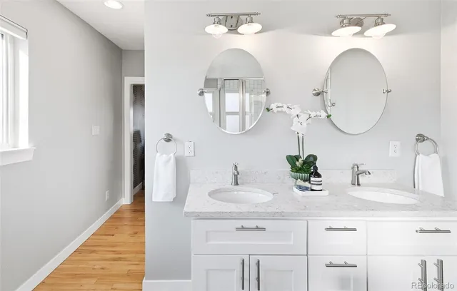 a bathroom with a shower and a mirror