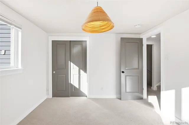 a room with gym equipment and windows