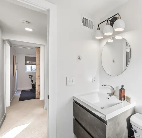 a bathroom with a tub shower and sink