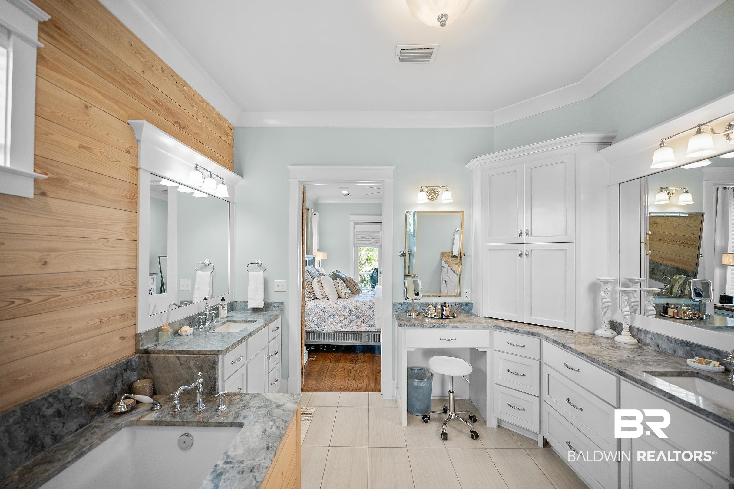 33186 Marlin Key Drive Orange Beach, AL 36561 - Photo 57 of 87 Full bath featuring ensuite bathroom, two vanities, a bath, light tile patterned flooring, and ornamental molding