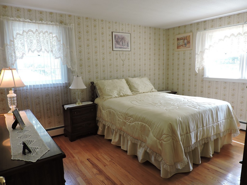 22 Palo Alto Road Springfield, MA 01128 - Photo 12 of 28 a bed sitting in a bedroom next to a window