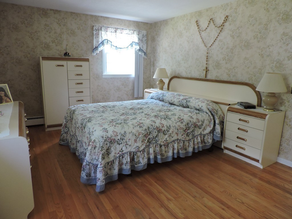 22 Palo Alto Road Springfield, MA 01128 - Photo 13 of 28 a bedroom with a bed and a dresser