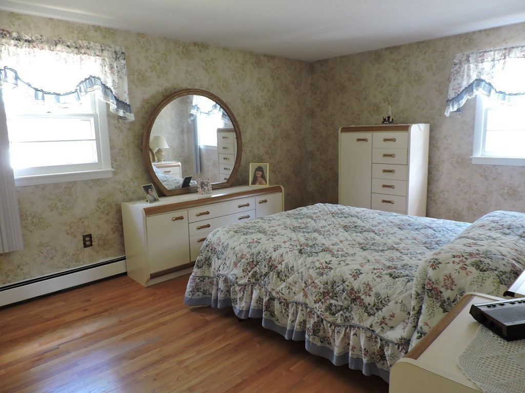 22 Palo Alto Road Springfield, MA 01128 - Photo 14 of 28 a bedroom with a bed mirror and a window