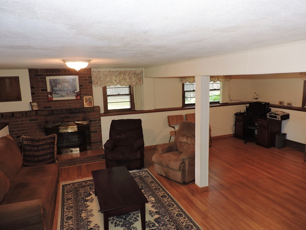 22 Palo Alto Road Springfield, MA 01128 - Photo 21 of 28 a living room with furniture and a fireplace