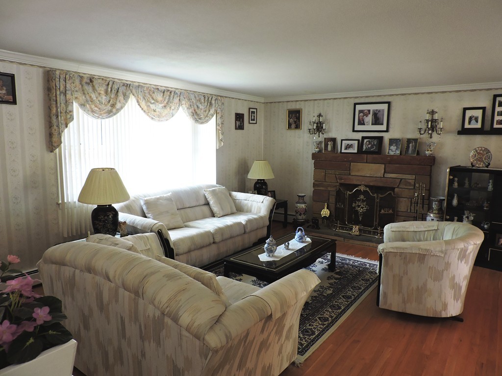22 Palo Alto Road Springfield, MA 01128 - Photo 5 of 28 a living room with furniture and a fireplace