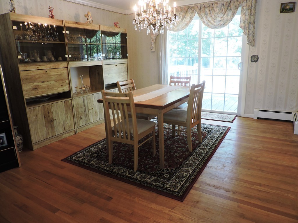 22 Palo Alto Road Springfield, MA 01128 - Photo 8 of 28 a dining room with furniture a rug and wooden floor