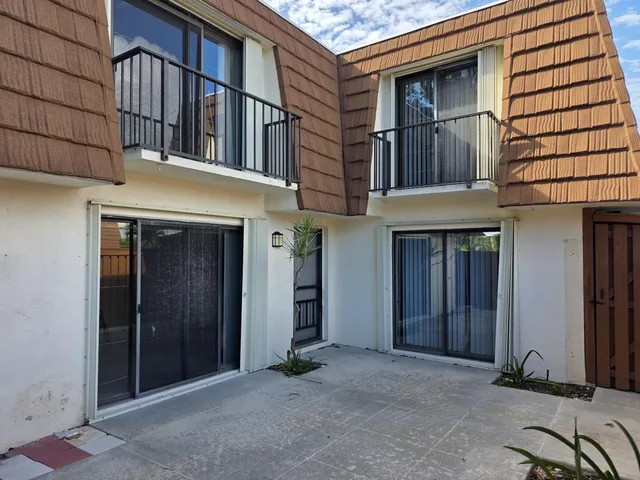 a view of a building with a door and a window