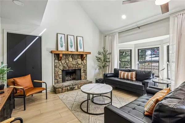 a living room with furniture and a fireplace