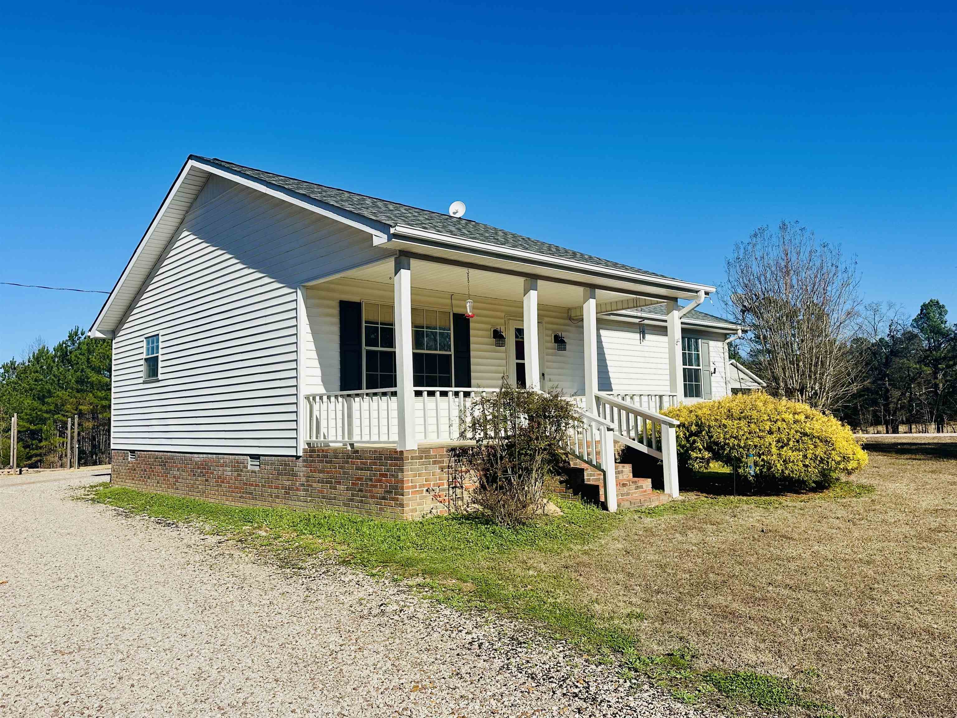 3566 Highway 142 Selmer, TN 38375 - Photo 14 of 20 Bungalow featuring crawl space, a porch, a front lawn, and a shingled roof