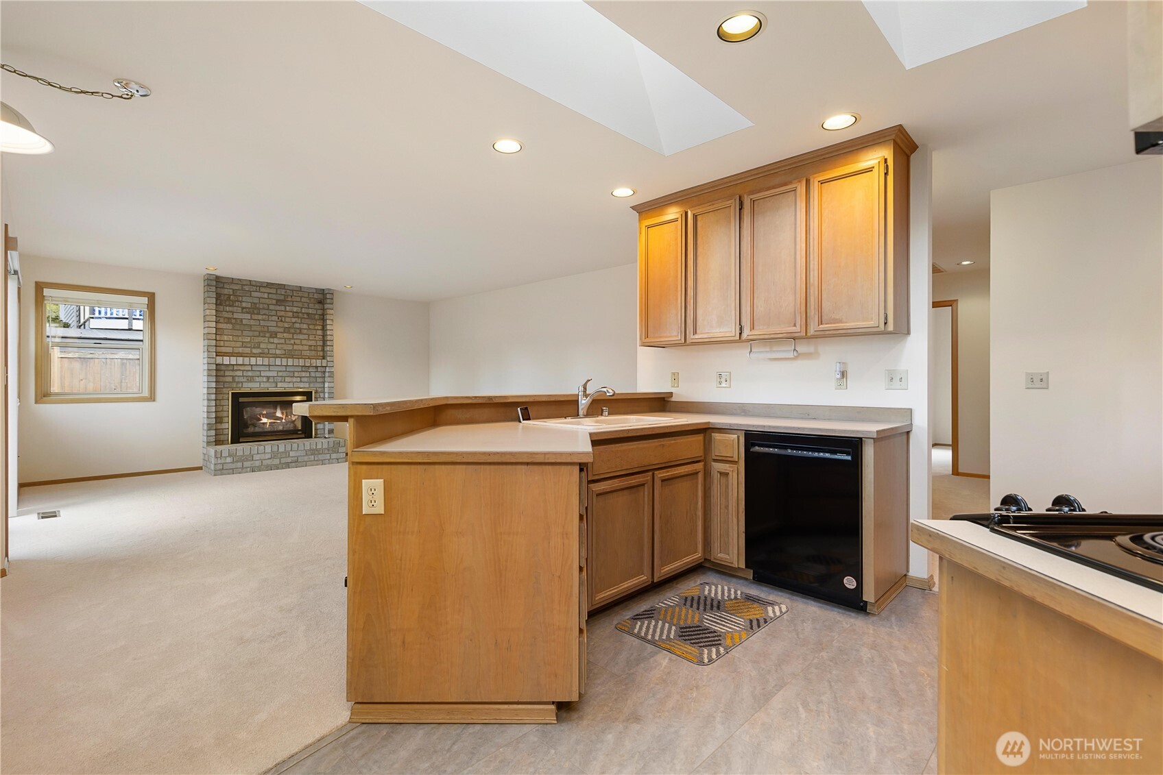 8523 199th Place Southwest Edmonds, WA 98026 - Photo 17 of 40 a kitchen with stainless steel appliances granite countertop a stove a sink and a microwave
